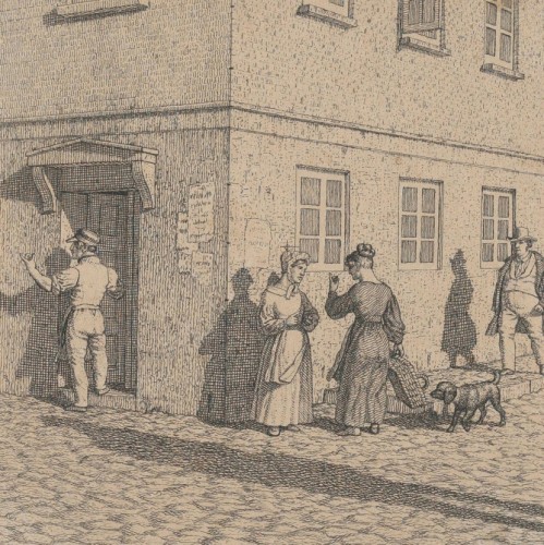 A couple conversing in a stable yard