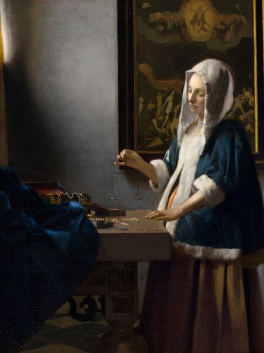 Woman Holding a Balance