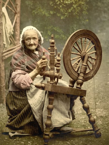 Irish spinner and spinning wheel. County Galway, Ireland