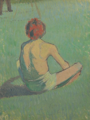 Boy sitting in the grass